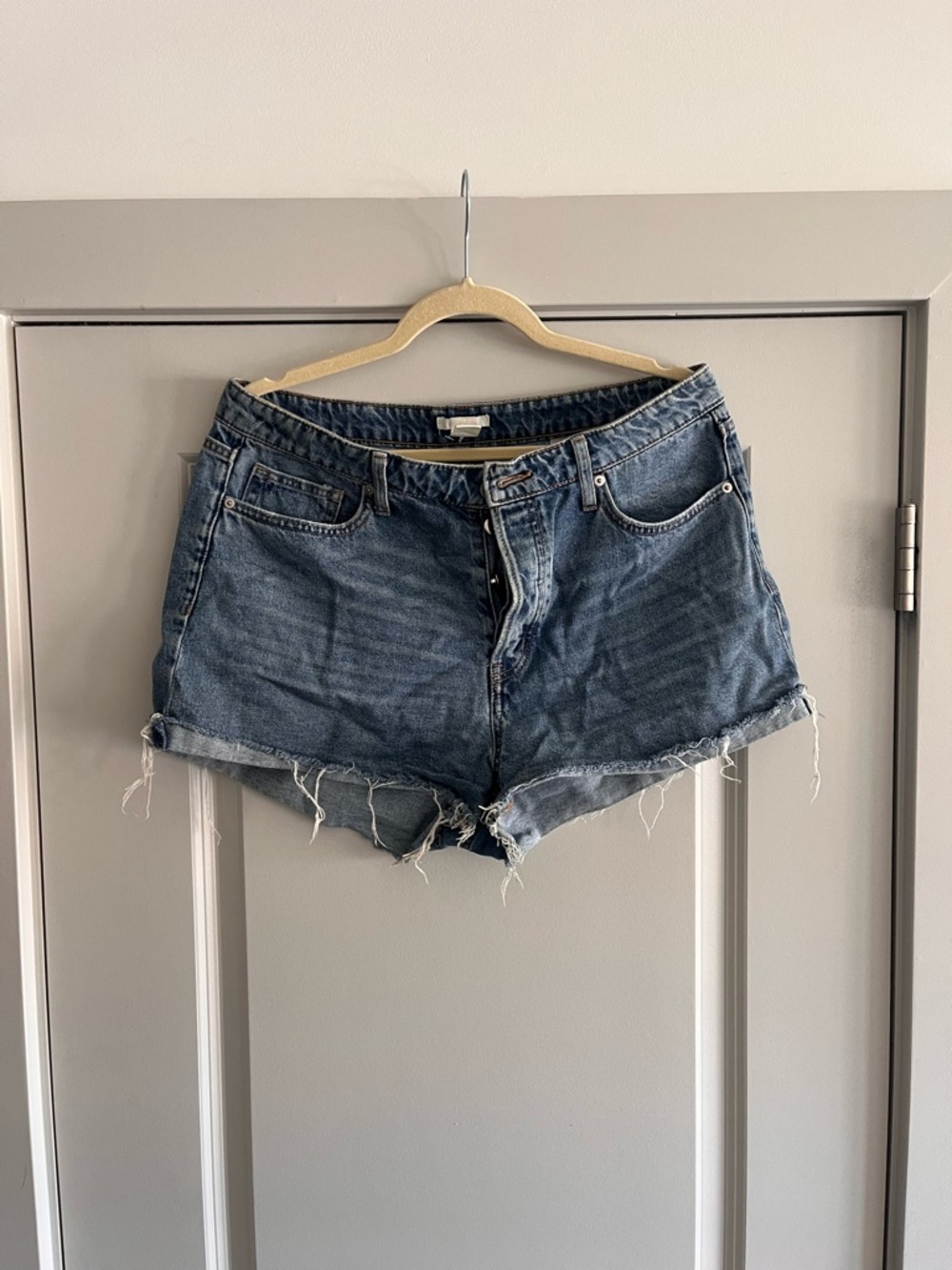 Denim Cutoff Shorts in Medium Dark Blue - Women